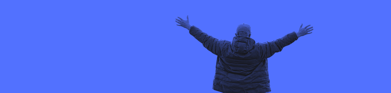 duotone image of young person with arms up