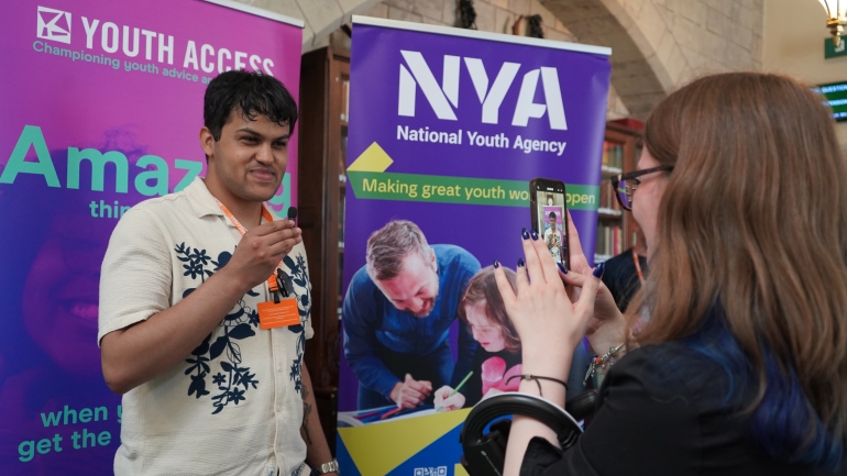 young person being filmed at youth access parliament event