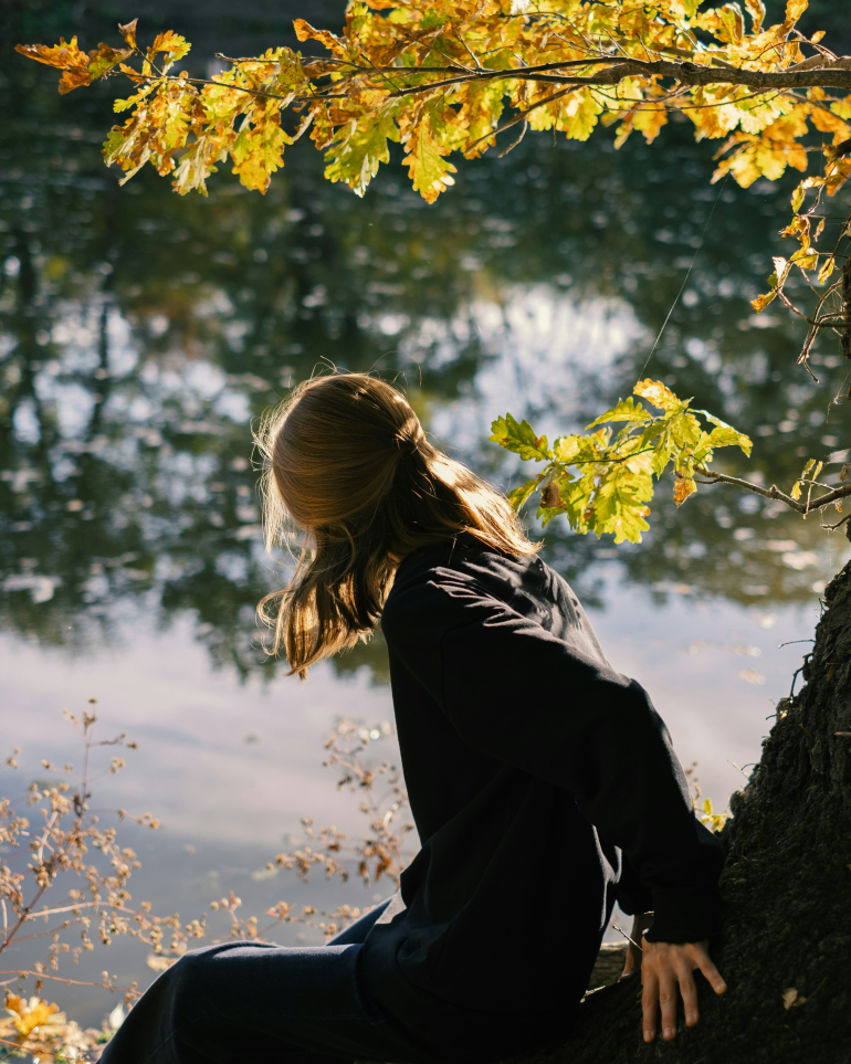 young person out in nature in autumn background